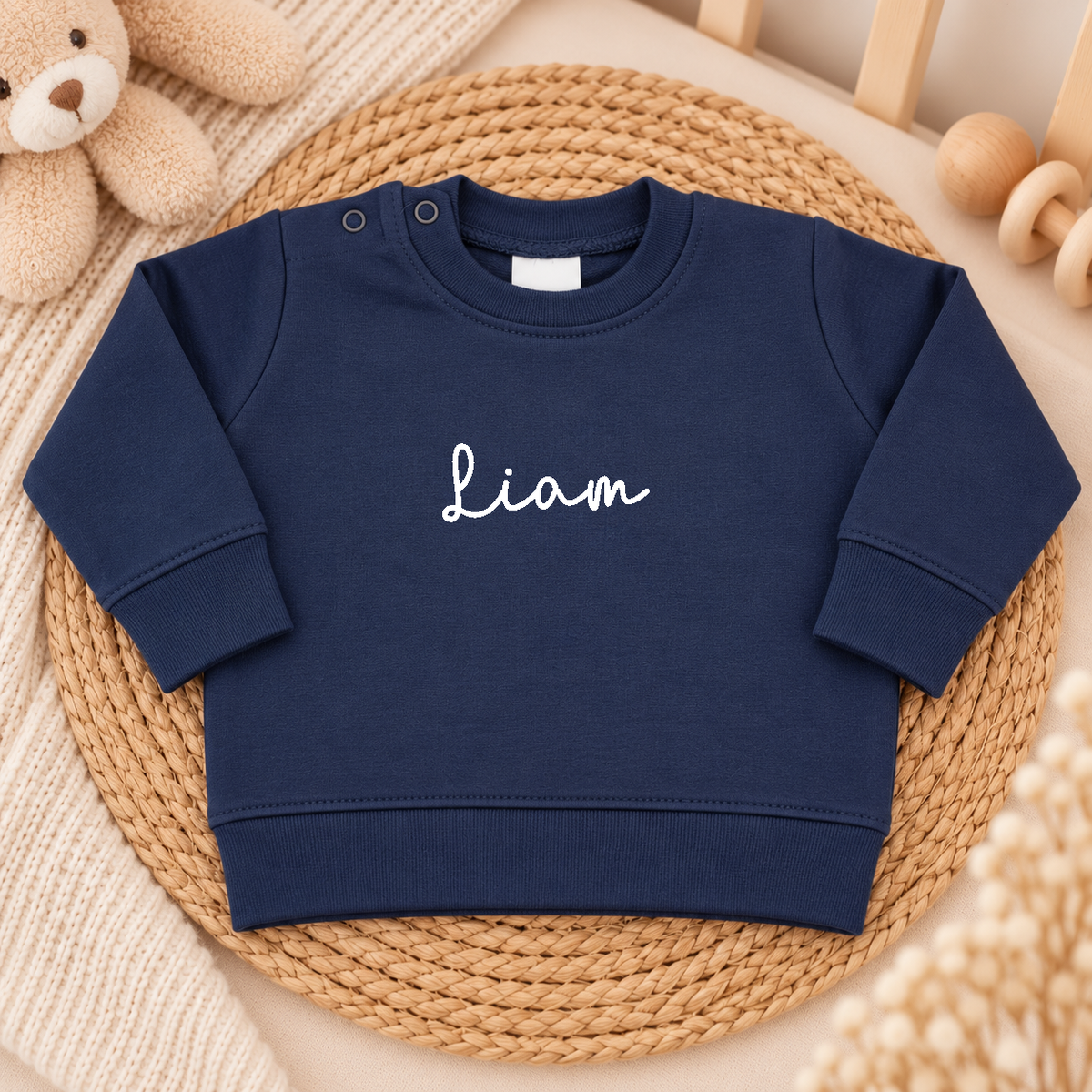 Donkerblauwe baby trui gepersonaliseerd met naam